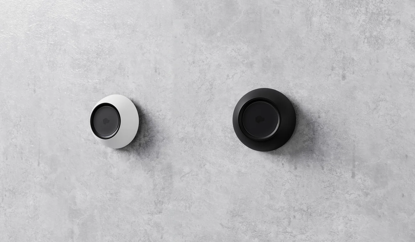 Josh Micro room microphones in white and black mounted on a concrete wall